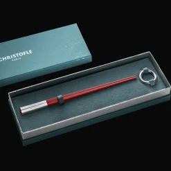 Set of two red Chinese chopsticks and chopsticks rests